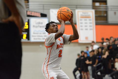 Senior guard Zaylen Shealer heads to the line for free throws for a game earlier in the season, as he had 16 points against Hebron and 14 points against Prince Avenue. Photo by Benjamin London.