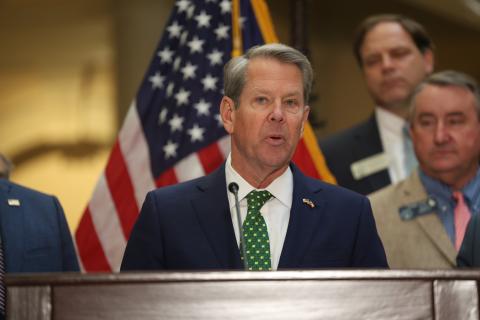 Gov. Brian Kemp speaks before signing Georgia House Bills 1199 and 1000 into law at the Georgia State Capitol March 20. The laws suspend the state motor fuel tax for 60 days and implement one-time income tax rebates. Photo by Ashtin Barker, Capitol Beat
