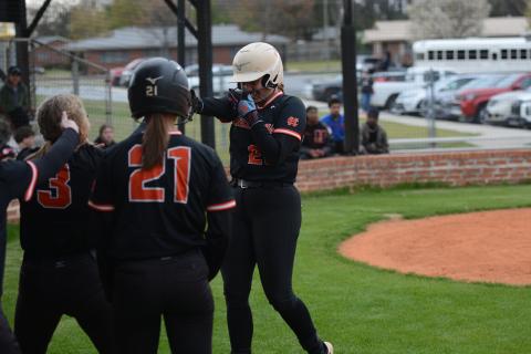 Chesnee Strickland (right) celebrates with her teammates after hitting a three-run home run to start the 21 run inning in the 21-1 game two  win against Hancock Central March 18. Photo by Benjamin London. 