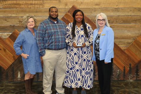 Pictured (L-R) are Superintendent Jennifer Carter, Mathius McNeill, Hartwell Elementary School Principal Ashley McNeill and Julie Franklin after Ashley received the district's 2025-2026 Philip Wright Award at Pioneer RESA. Photo submitted by Grayson Williams. 
