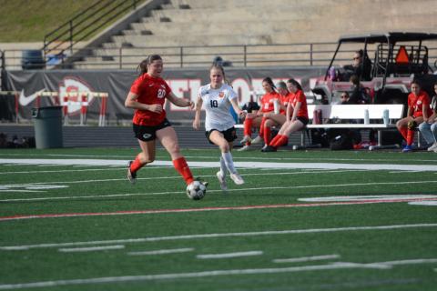 Forward Isla Bell (right) battles against a Lady Indians defender in the 2-1 road loss to Stephens County March 20. Photo by Benjamin London. 