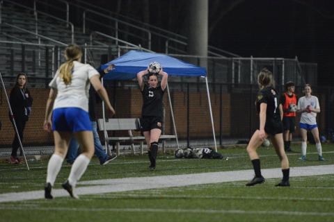 Midfielder Madison Heaton throws the ball into play during a match earlier in the season, as she scored two goals in the 6-0 win over Greene County March 16. Photo by Benjamin London.