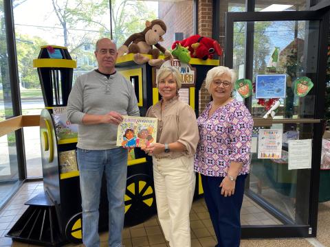 Hart County Farm Bureau Office Manager Tina Simmons (right) and Angie Brown from Hart EMC (center) recently presented a copy of the children’s ag book “I Love Blueberries” to Richard Sanders (left) for the Hart County Public Library. The donation was made on behalf of the Georgia Foundation for Agriculture and Georgia EMC. (Photo submitted by Tina Simmons)