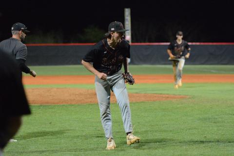 Sophomore pitcher Aiden Kennedy celebrates after striking out the final batter to hang on to win, 7-6, against the Indians of Stephens County in eight innings March 30. Photo by Benjamin London. 