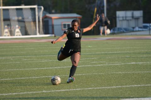 Aidyn Craft scores off of a free kick in the 7-0 shutout win over the Lady Bulldogs of Thomson April 3.  Photo by Benjamin London.