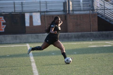 Aidyn Craft takes a free kick, as she later scored on a penalty kick in the 4-2 loss to Lady Cavaliers of Callaway in the first round of the state playoffs April 23.  Photo by Benjamin London.