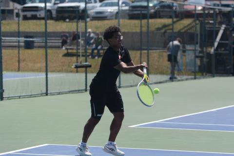 Derrick Campbell returns a serve, as him and Carson Hart dominated No. 2 doubles, 6-0 and 6-0, to help capture a 5-0 win over Hardaway April 22. Photo by Benjamin London. 