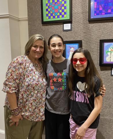 April Garner is pictured with students (L-R) MaKinley Cleveland and Savannah Shultz at the opening of the Youth Exhibit at the Hartwell Art Center on April 3. (Photo courtesy of April Garner)