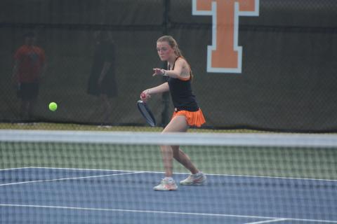 Senior Lucee Patrick rears back to return the serve, as the Lady Dogs fell just short on senior night to the Lady Indians of Stephens County, 3-2, March 26.  Photo by Benjamin London. 