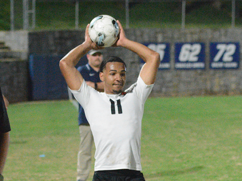 Elijah Garnett throws the ball into play, as he had an assist in the 7-2 win over the Blue Devils of Elbert County April 14. (Photo by Benjamin London) 