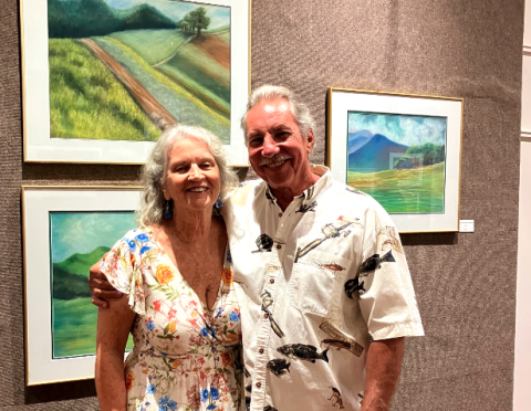 Pictured during the opening night of Nancy Duckworth's display at the Hartwell Art Center are (L-R) Duckworth and her husband, John Atkinson. Her display, "Earth's Beauty: Lands, Waters, Skies" is open through May 16.  Photo submitted by Nancy Duckworth. 