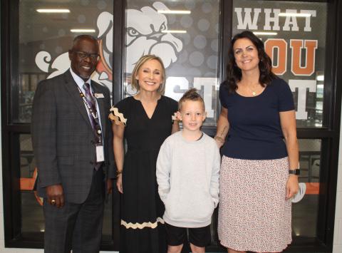 Pictured (L-R), are North Hart Elementary Assistant Principal David Pressley, Principal Christina Weir, second-grade student Parker Holmes and  second-grade teacher Amy  Martin. Photo by Grayson Williams. 