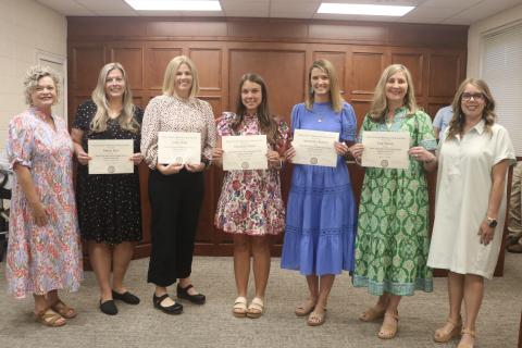 Hart County Charter System's 2026-2027 Teachers of the Year were recognized during the Hart County Board of Education's May 11 meeting. Pictured with Superintendent Jennifer Carter (far left) and board chair Kim Pierce (far right) are (L-R) Robyn Rice from Hart County Middle School, Leigh Floyd from South Hart Elementary School, Meredith Dunn from North Hart Elementary School, Samantha Burton from Hartwell Elementary School and Lisa Fanczi from Hart County High School. Photo by Grayson Williams.