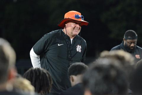 Hart County’s new head football coach Biff Parson speaks with the team after their first summer practice June 2. Photo by Benjamin London.