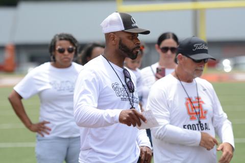 Campers compete in multiple offensive and defensive position drills in the second annual Harper Island Training Youth Football Camp lead by Class of 2004’s Mikendric Harper (pictured middle) June 20. Photo by Benjamin London.