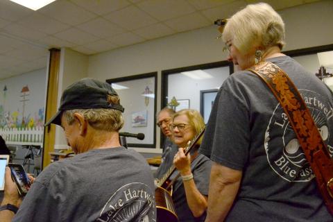 Above (L-R) Richard Frady, Daniel Meth, Jo Ann Moore and Terri Cleveland prepare for a performance at the Hart County Senior Center. Photo by Madison Linton.
