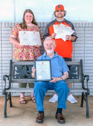 Photographer Bill Powell (front), and (back row, L-R) Editor/Publisher Rose Scoggins and Sports writer Benjamin London, along with The Hartwell Sun staff, brought home six awards in the Georgia Press Association's Better Newspaper Contest. Photo by Susan Culver. 
