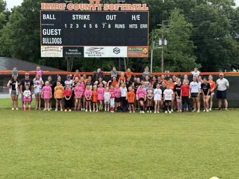 Pictured is the 30 plus campers, current players and coaches who attended or help lead the annual Little Bulldog Softball Camp June 8-10.  Photo by Benjamin London.