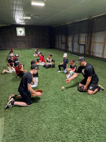 High school and middle school players help lead a fielding drill at the annual Youth Baseball Camp June 22-24. Photo submitted by Hart County Baseball. 