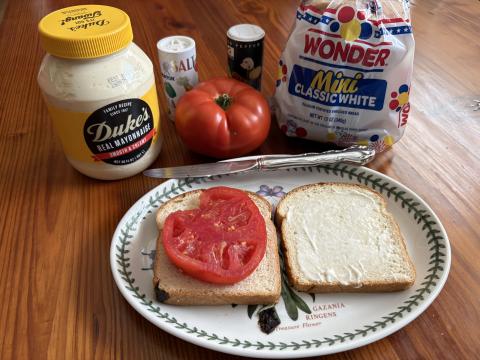 A home-grown tomato sandwich is a celebration of summer. All you need is a slice of juicy tomato big enough to cover a piece of white bread, a slathering of Duke’s mayonnaise and sprinkles of salt and pepper. And if you like BLTs, by all means, add bacon and lettuce. Photo by Dink NeSmith. 