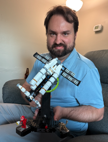 Michael holds one of the three Lego sets we've put together in the past month, the spaceship from the movie "Project Hail Mary." Photo by Rose Scoggins.