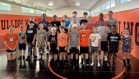 Pictured is the morning group of campers ages five to 12-years-old, along with former and current wrestlers who participated in the basics to wrestling camp July 17.  Photo submitted by Hart County Wrestling.