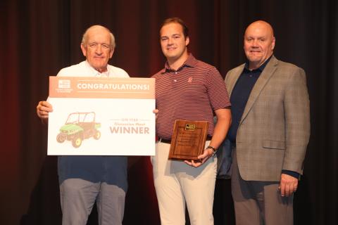 Georgia Farm Bureau President Tom McCall (left) and Tony Hutchins of Southern Farm Bureau Life Insurance (right) congratulate GFB YF&R Discussion meet winner Michael Howard (center). Photo courtesy of Georgia Farm Bureau.