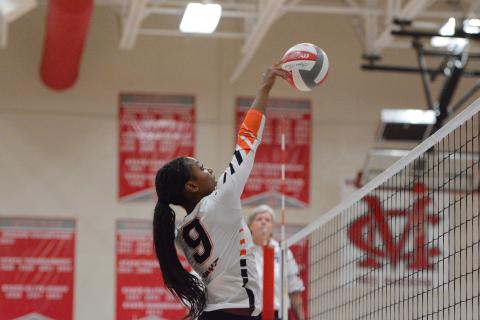 Pictured is middle Trinity Freeman, who goes up for a tip. Photo by Benjamin London. 