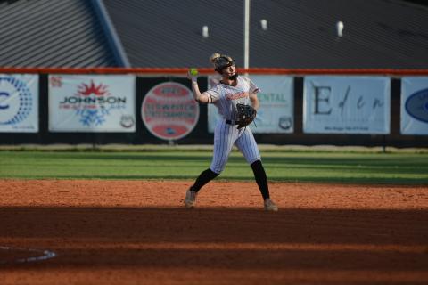 Pictured is second baseman Carly Dutton throwing the ball over to first for an out. Photo by Benjamin London. 