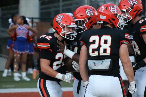 Junior running back Carson Hart (22) celebrates with his teammates after scoring a rushing touchdown in the 48-14 win over the Jaguars of Cedar Shoals Sept. 4.  Photo by Grayson Williams. 