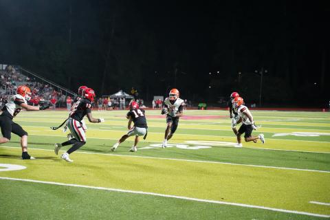 Senior wide receiver Kurston Curry makes a defender miss after the reception, as he set the school record for most receptions in a game with 13. Photo by Ric Williams. 