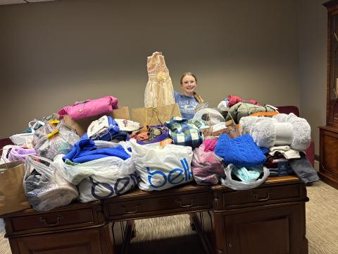 Hart County Middle School student and junior 4-H'er Nakalegh Cromer is sponsoring the winter clothing drive again this year. Cromer is pictured above with the donations received during last year's drive. Photo submitted by Ruth Tellano-Daniel.