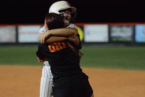 Freshman outfielder Peyton Jordan celebrates with assistant coach Kalyn Jinks after walking it off against the Lady Bulldogs of Morgan County Sept. 1, 9-8.  Photo by Benjamin London. 