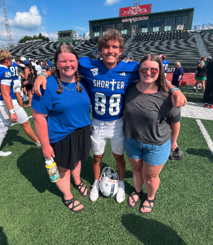 Pictured post-game with our "little" cousin Bryson (center), are Marlie (right) and me. Eight years younger than me and three younger than Marlie, Bryson is in his sophomore year at Shorter University. Photo courtesy of Rose Scoggins. 