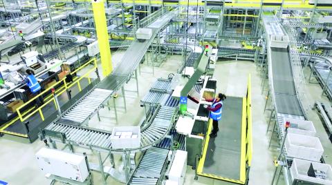 A screenshot from a Walmart promotional video shows the inside of the company’s next-generation fulfillment centers that combine the work of employees, robotics and automated shipping technology to move packages to customers. Walmart announced last week that a new next-generation fulfillment center will be built in Franklin County and employ 1,000 workers. Photo courtesy of Walmart.com.