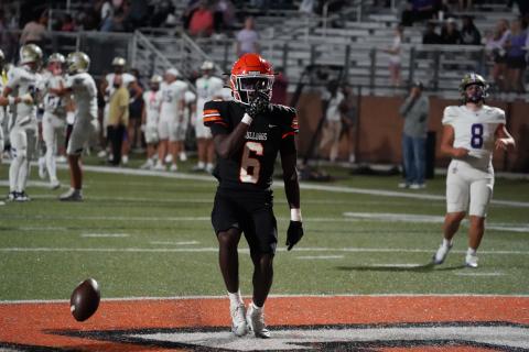 Senior running back Xavier Allen celebrates after a touchdown run that was later called back, as the Dogs went on to defeat the Indians of Lumpkin County 50-14 to remain undefeated. Photo by Ric Williams. 