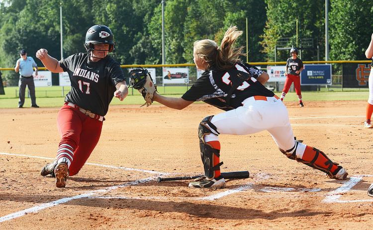 Sunshots by Michael Hall Hart County catcher Annslee Mitchell tags out Stephens County baserunner Kasey Westmoreland on Saturday at Hart County High School during the Lady Diamond Dogs’ 13-1 loss in the first game of the season.