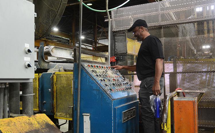 Sunshots by Michael Hall — Thomas Newman stands behind the draw bench where he once worked during his time at the Tenneco/Monroe facility Hartwell.