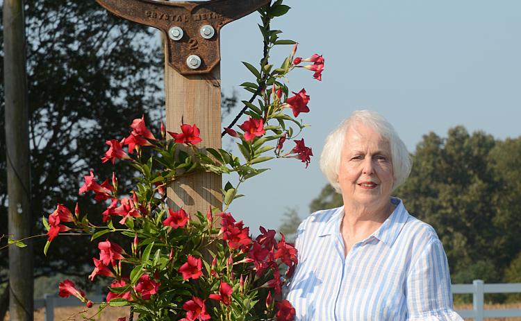Sunshots by Michael Hall Mary Jo Shiflet poses for a photo, above, near an old farm bell in her yard just outside of Hartwell. Shiflet, 78, has a positive outlook on life despite tragedies from the past.
