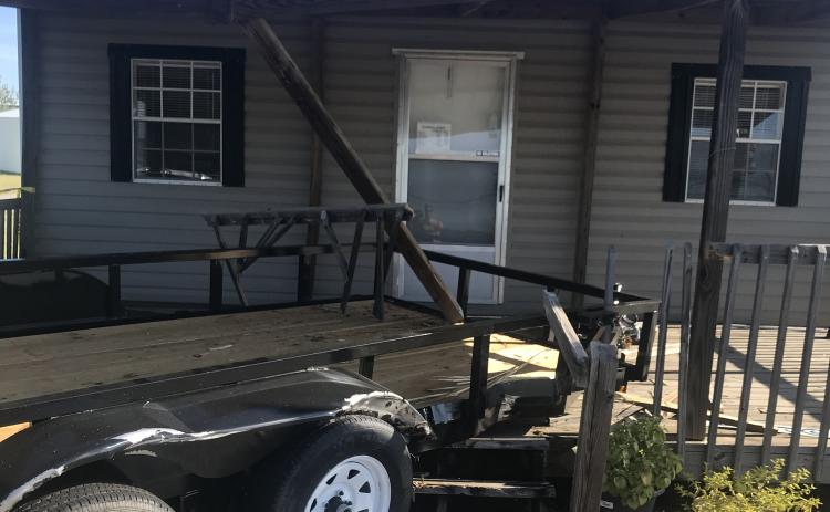 Photo submitted — A trailer is shown crashed into a porch on the front of the office at Rockland Mini Buildings in Hartwell after an SUV drove through the lot on E. Franklin Street sometime early Sunday morning, Sept. 22, damaging property.