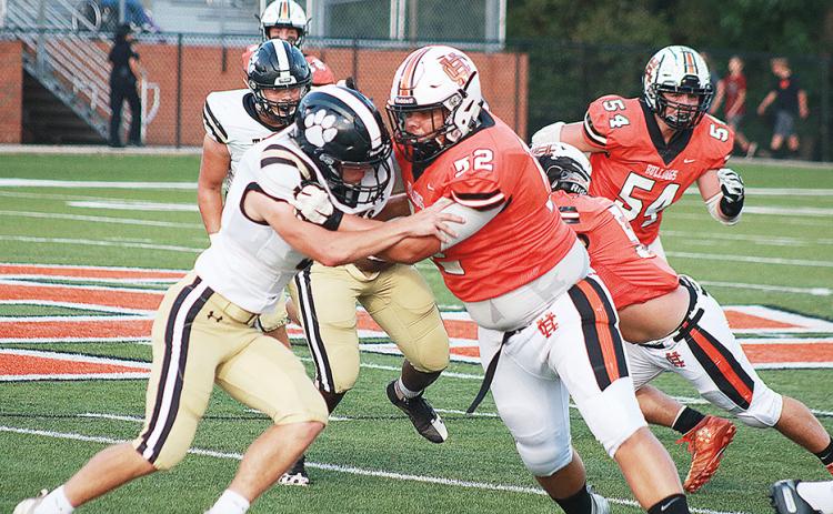 Sunshot by Grayson Williams — Gabriel Coker, No. 52, blocks for running back Malachi Thomas on a play in which Thomas broke a big run for a touchdown.
