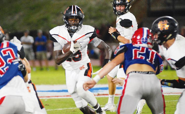 File photo — Malachi Thomas looks for running room in last year's game at Jefferson.