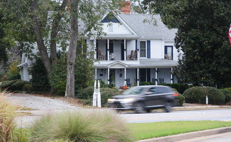 Sunshot by Michael Hall — Traffic passes on Benson Street Wednesday morning in front of the Skelton house.