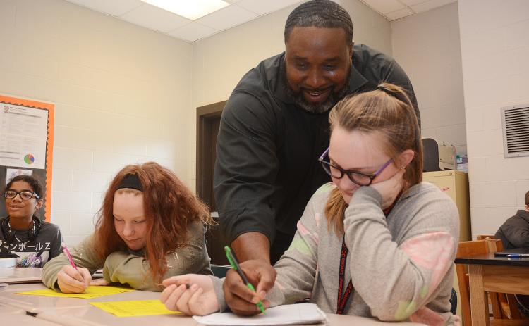 Sunshot by Michael Hall — Middle school teacher Earl Fouch helps students during a math exercise at Hart County Middle School on Monday, Nov. 4.