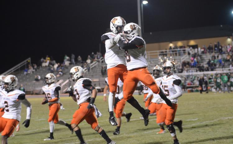 Bulldog players celebrate after a touchdown against Franklin County on Nov. 1.