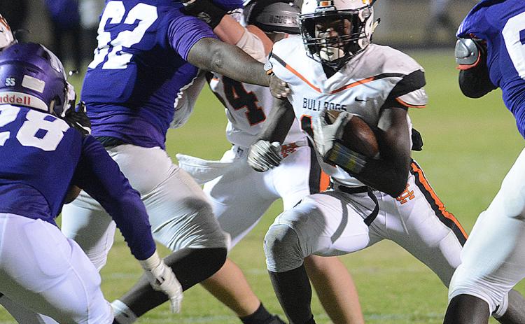 Sunshot from file by Grayson Williams - Malachi Thomas, No. 19, celebrates a touchdown with quarterback Luke Lee during the 2019 Hart County football season.
