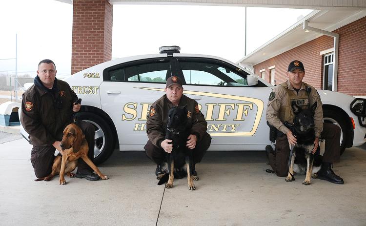 Sunshot by Grayson Williams - Pictured from left to right are, deputy Jarod Tollison and Parker Jean, deputy Josh Fowler and Chuck and deputy Steve Williams and Sena.