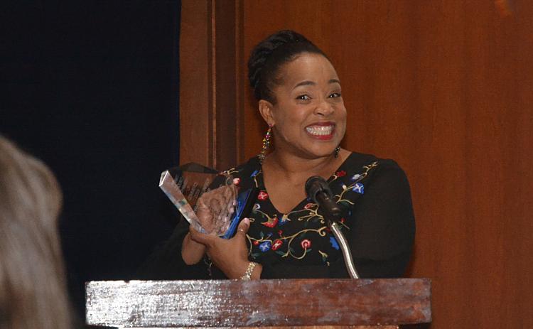 Sunshots by Michael Hall Kristie Rucker smiles as she speaks to the crowd at the annual Hart County Chamber of Commerce Awards Banquet after winning the Volunteer of the Year Award.