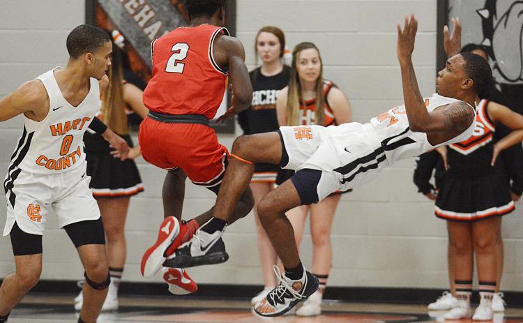 Hart County Junior Shone Webb falls backward after colliding with Stephens County’s Chris Sinclair at Hart County High School on Jan. 24.