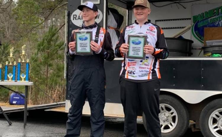 Photo submitted - Dallas Hancock, left, and Xander Patton, show off their first-place plaques for winning the PBC tournament on Lake Russell.